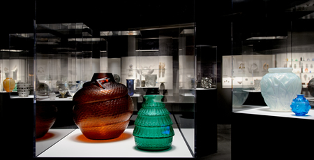 Rene Lalique Enchanted By Glass Exhibition At The Corning Museum View Inside The Exhbition Showing Amber Serpent and Green Ferriers Vases In Foreground