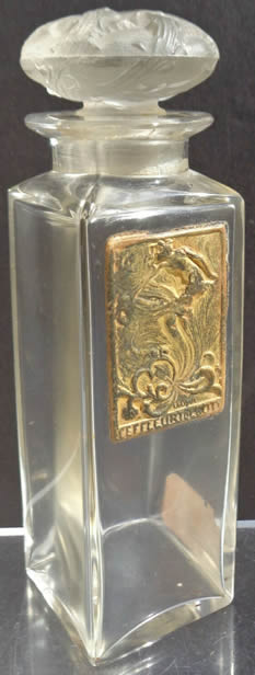 An 11cm Coty Eau De Toilette Perfume Bottle Made By Coty Glassworks That Is A Copy Of The Rene Lalique Design With Brass Plaque Label For L'Effleurt De Coty. The Label Is Signed For Lalique But No Signature to the underside For Coty Or Lalique