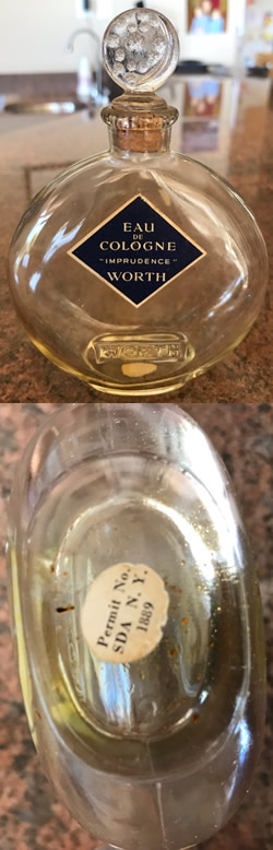 Close Copy Of Je Reviens-5 Perfume Bottle For Worth Marked With Sliver Moon and Stars Stopper And Molded WORTH To The Front Face. Believed Made For Worth By An Unknown U.S. Glassmaker During The War With Cork Stopper. Unsigned. Also Showing White Label On Underside.