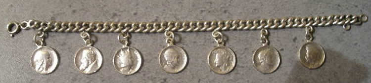 Louis Armand Rault Bracelet Having Seven Different Medallions All With LR Signature - RL Signature