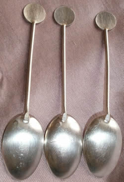 Reverse View Of Silver Spoons With Louis Rault Designs Incorporated In The Handles